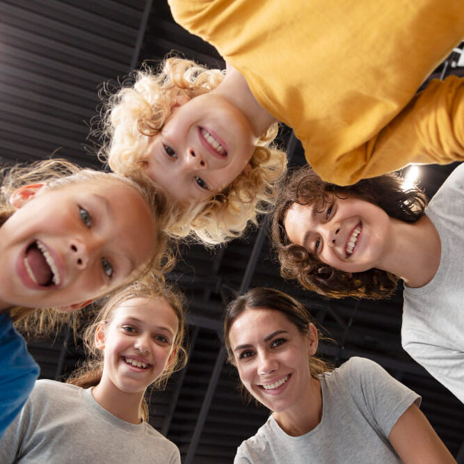 sports-teacher-with-her-students (1) sports-teacher-with-her-students (1)